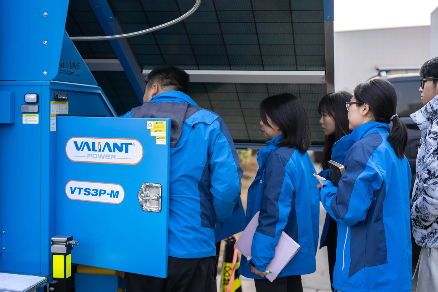 Team reviewing a Valiant equipment cabinet